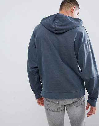 ASOS Design DESIGN oversized hoodie with colour block sleeves in navy vintage wash