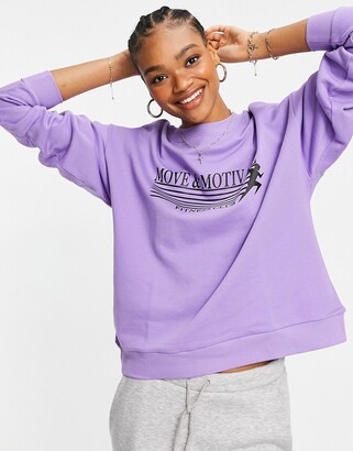 ASOS DESIGN sweatshirt with move and motivate graphic in purple