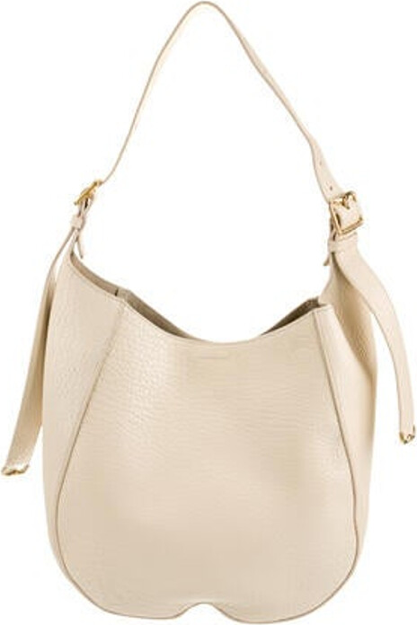 Burberry Hobo Neutrals Leather Gold-Tone Hardware Single Adjustable Shoulder Strap Suede Lining Snap Closure at Top Includes Interior Zip Pouch Unfortunately, due to restrictions, this item may not be eligible for shipping in all areas.