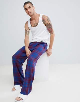 ASOS Design DESIGN straight pyjama bottoms in check with branded waistband-Navy