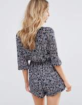 Thumbnail for your product : WYLDR Wyldr Twin Shadow Daisy Printed Tie Front Romper