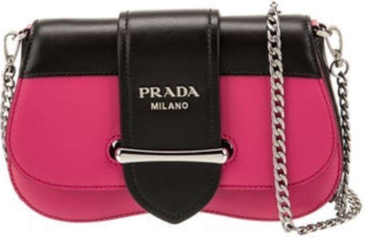 Prada Crossbody Bag Black & Pink City Calf Leather Silver-Tone Hardware Chain-Link Shoulder Strap Chain-Link Accents Leather Lining & Single Interior Pocket Fold-In Flap Closure at Front Includes Dust Bag & Authenticity Card Unfortunately, due to restrictions, this item may not be eligible for shipping in all areas.