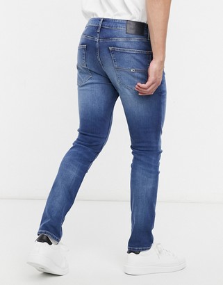 Tommy Jeans austin slim tapered jeans in mid wash - ShopStyle