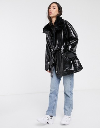 Weekday vinyl faux fur-lined belted coat in black