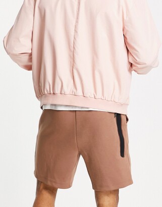 pink nike tech fleece shorts