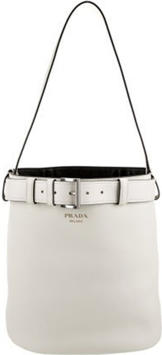 Prada Bucket Bag From the 2024 Collection by Miuccia & Raf Simons Nero Vitello Grain Leather Graphic Print Silver-Tone Hardware Single Shoulder Strap Leather Lining & Single Interior Pocket Buckle Closure at Front Includes Dust Bag Unfortunately, due to restrictions, this item may not be eligible for shipping in all areas.