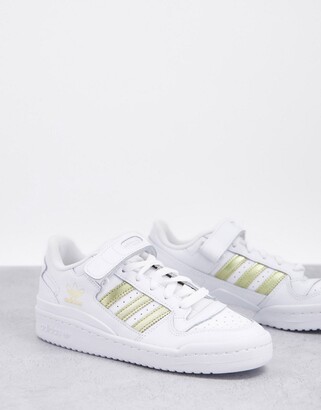 adidas Forum Low sneakers in white and gold - ShopStyle