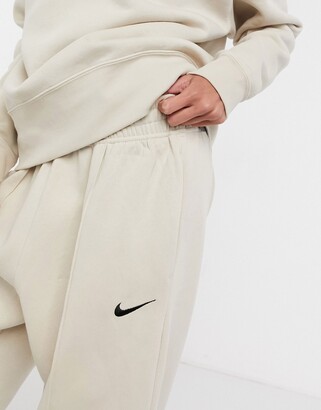 Nike mini swoosh oversized sweatpants in cream - CREAM - ShopStyle