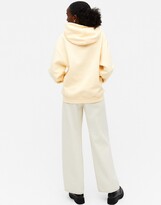 Thumbnail for your product : Monki Oda cotton hoodie in yellow - YELLOW