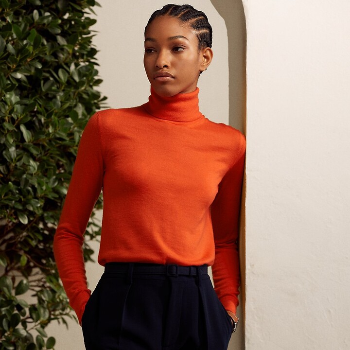 orange turtleneck top