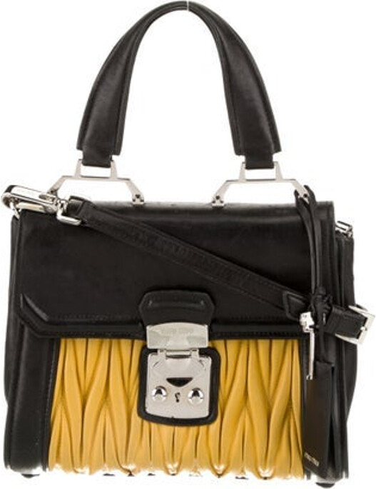 Miu Miu Top Handle Bag Yellow Lambskin Colorblock Pattern Silver-Tone Hardware Flat Handle & Single Adjustable Shoulder Strap Leather Lining & Dual Interior Pockets Push-Lock Closure at Front Protective Feet at Base Includes Keys & Clochette