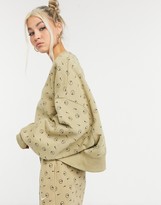 Thumbnail for your product : Nike all-over logo print cropped sweatshirt in camel