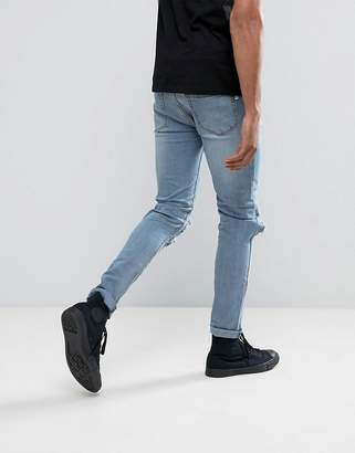 Roadies Of 66 Stone Wash Skinny Jeans With Blown Out Knees And Embroidery