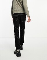 Thumbnail for your product : ASOS DESIGN stretch slim jeans with panels in black