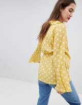 Thumbnail for your product : Glamorous Bloom Wrap Blouse With Bell Sleeve In Polka Dot