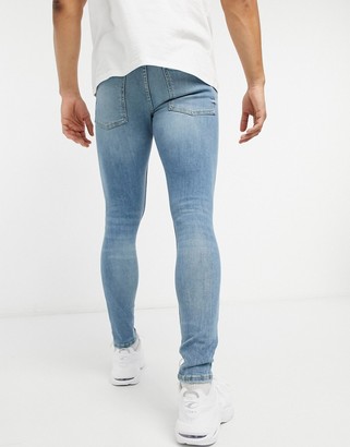 Bershka super skinny jeans with rips in light blue - ShopStyle