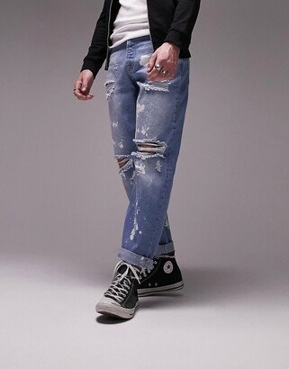 Topman rip and bleach relaxed jeans in mid wash