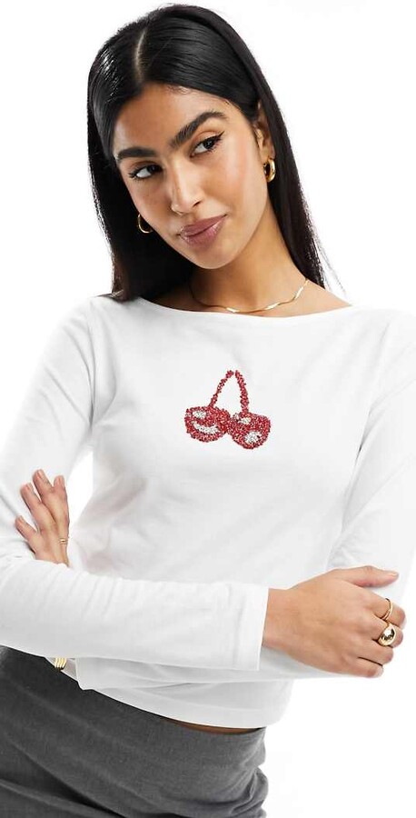 ASOS DESIGN embellished cherry long sleeve slash neck top in ivory