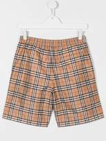 Thumbnail for your product : Burberry Kids TEEN Vintage check swim shorts