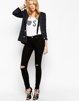 Thumbnail for your product : ASOS COLLECTION Lisbon Skinny Mid Rise Jeans in Black with Displaced Knees