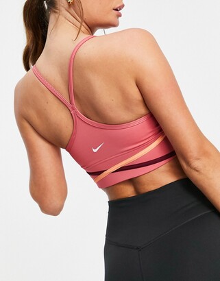 Nike Training One light support twist detail sports bra in pink - ShopStyle