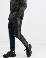 Thumbnail for your product : ASOS DESIGN two-piece skinny sweatpants with elastic waist and printed side stripe in black