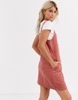 New Look cord button through pinny dress in pink