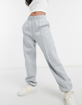 Nike trackies in dark grey neutral - ShopStyle Trousers