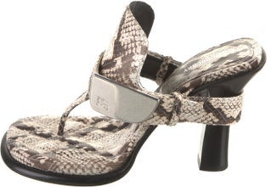 Burberry Snakeskin Slides Neutrals Animal Print Buckle Closure at Sides Includes Dust Bag Unfortunately, due to restrictions, this item may not be eligible for shipping in all areas.