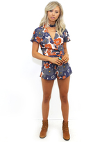 Thumbnail for your product : West Coast Wardrobe Light of Night Floral Romper in Navy/Rust