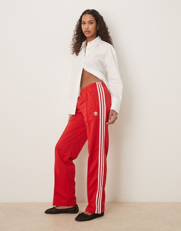 adidas firebird track pants in red