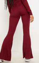 Thumbnail for your product : PrettyLittleThing Burgundy Rib High Waisted Flare Leg Trouser