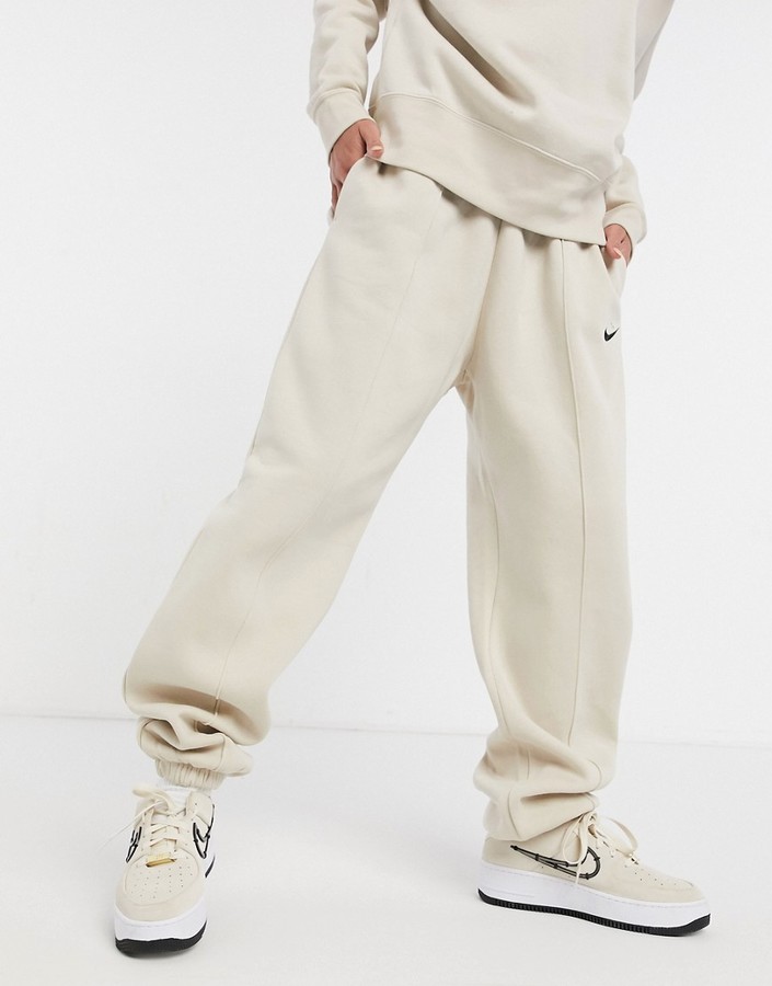 nike mini metallic swoosh oversized joggers in yellow