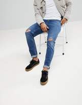 Thumbnail for your product : ASOS DESIGN Slim Jeans In Vintage Dark Wash With Knee Rips