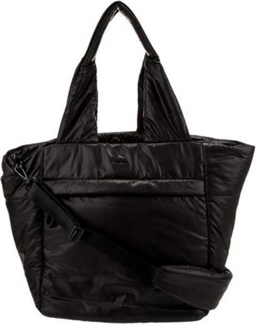 Caara Tote Black Nylon Tonal Hardware Leather Trim Dual Shoulder Straps Leather Trim Embellishment & Single Exterior Pocket Logo Jacquard Lining & Five Interior Pockets Zip Closure at Top Protective Feet at Base Includes Interior Zip Pouch | Caara Nylon Tote w/ Tags in Black
