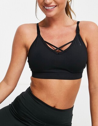 Nike Training Nike Yoga Indy light support cross strap sports bra in black  - ShopStyle