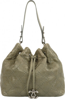 Chanel 1989-1991 Khaki Suede Drawstring Bucket Bag · INTO