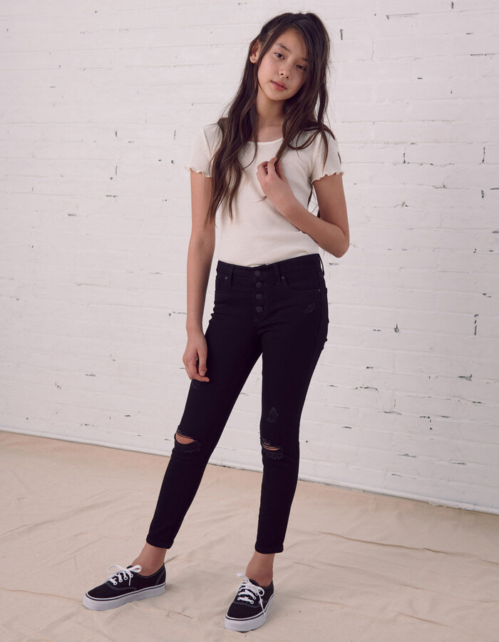 https://img.shopstyle-cdn.com/sim/4b/d7/4bd777a860d5de515ffbea8df881ead9_best/rsq-mid-rise-skinny-exposed-button-ripped-girls-black-jeans.jpg