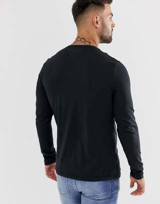 Tommy Hilfiger long sleeve top flag logo in black exclusive at asos