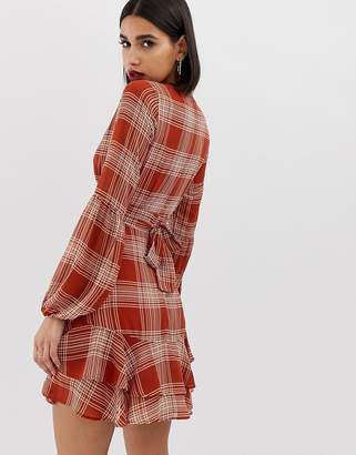 PrettyLittleThing plunge dress in rust check