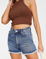 Thumbnail for your product : Monki raw hem denim shorts in mid blue wash