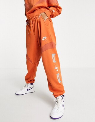 Nike Air oversized fleece joggers in orange - ShopStyle Trousers