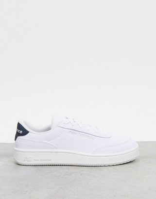 solid white new balance shoes