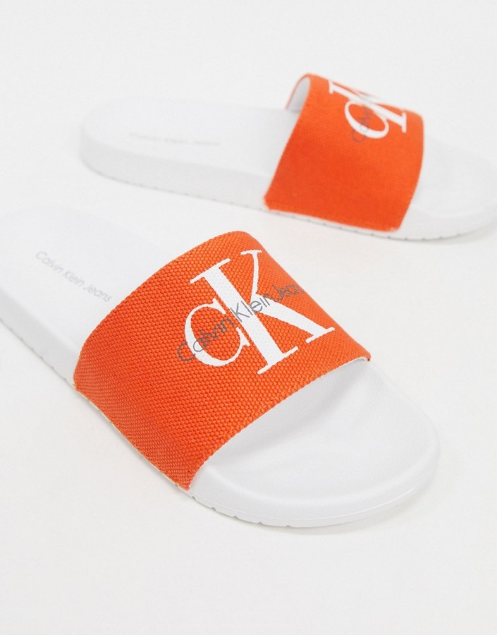 Calvin Klein viggo logo sliders in orange - ShopStyle Shoes