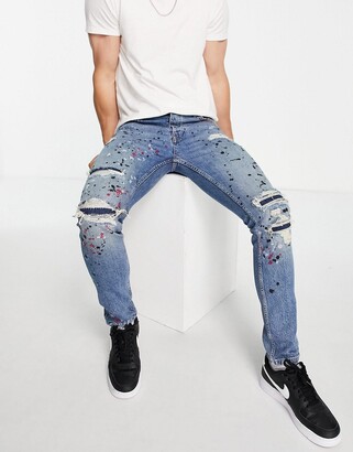 Topman stretch skinny rip and repair paint splat jeans in mid wash blue -  ShopStyle