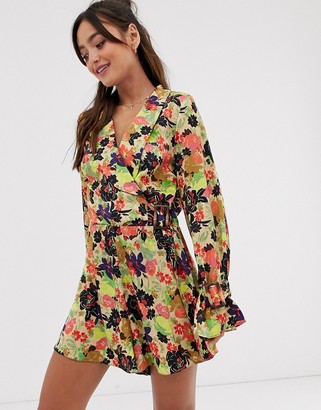 ASOS DESIGN DESIGN wrap romper with buckle and ruffle cuffs in jacquard floral print