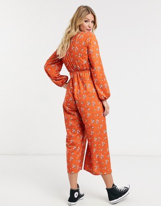 ASOS Maternity DESIGN maternity jersey tie front long sleeve jumpsuit in rust ditsy floral print