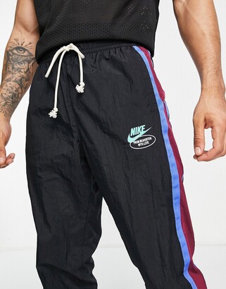 Nike 'Have a Day' unlined woven track pants in black - ShopStyle Trousers