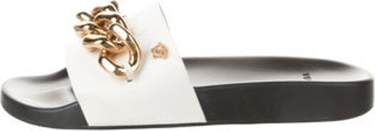 Versace Leather Slides Black Colorblock Pattern Chain-Link Accents Includes Dust Bag Unfortunately, due to restrictions, this item may not be eligible for shipping in all areas.
