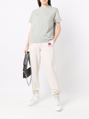 Axel Arigato Keith Haring-embroidered track pants